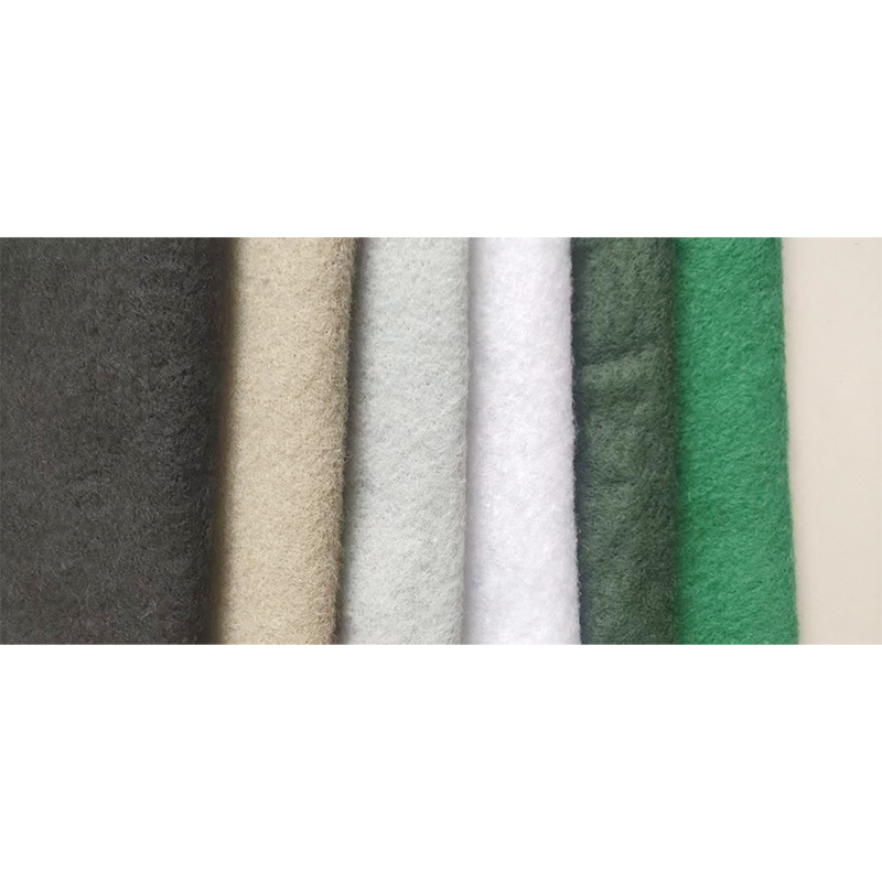 How can staple fiber needle punched geotextile prevent base layer cracks from reflecting onto the road surface during road construction?